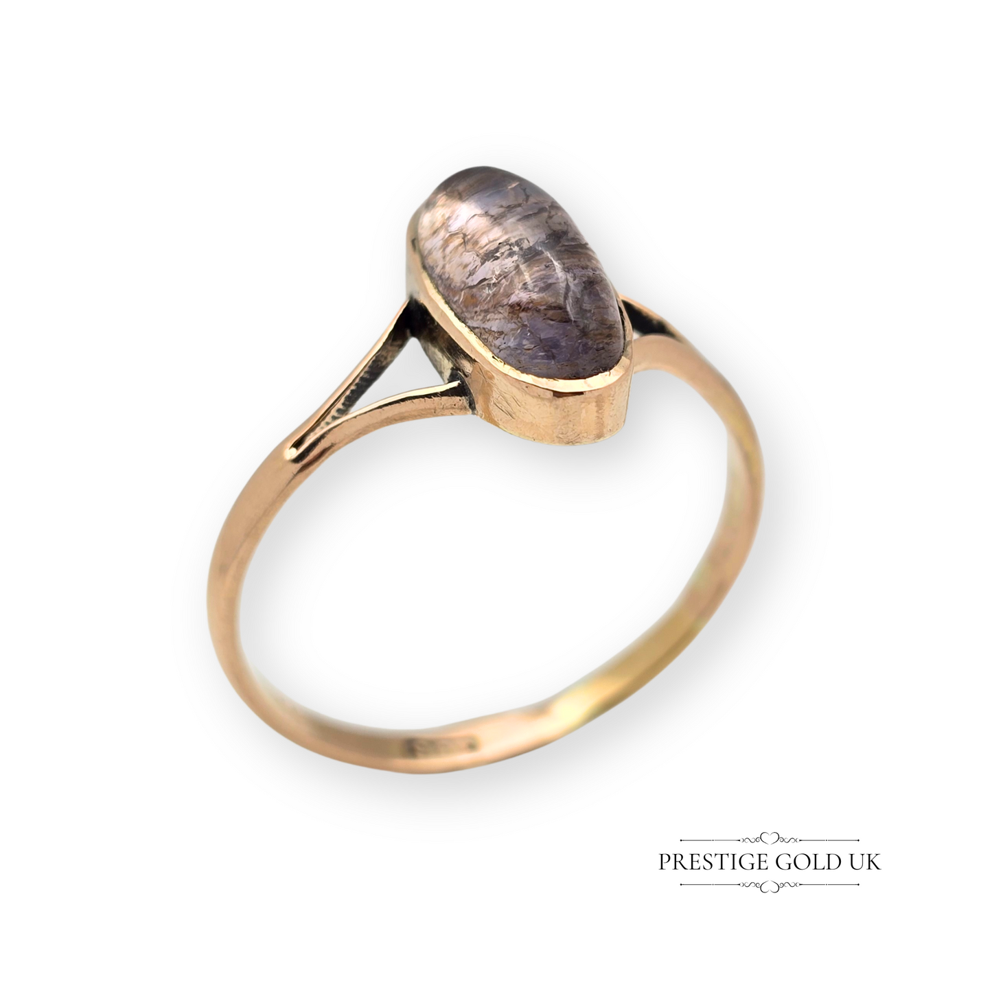 Antique 9ct rose gold ring featuring an oval cabochon-cut quartz gemstone with purple-brown tones, bezel set with split shoulders, UK size U.