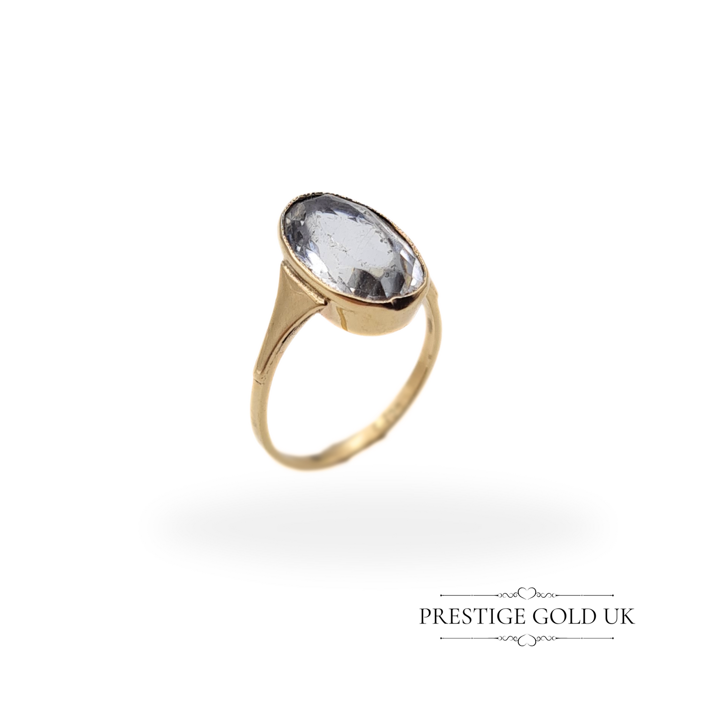 Vintage 9ct gold ring featuring a large sky blue quartz gemstone, oval bezel-set for an elegant and classic look.