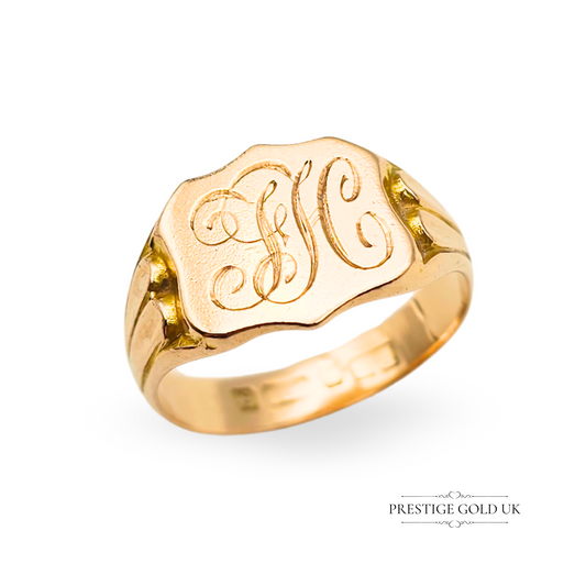 Antique 9ct rose gold signet ring with ornate design and engraved FH monogram, fully hallmarked Birmingham, featuring a bold oval face and elegant vintage styling.