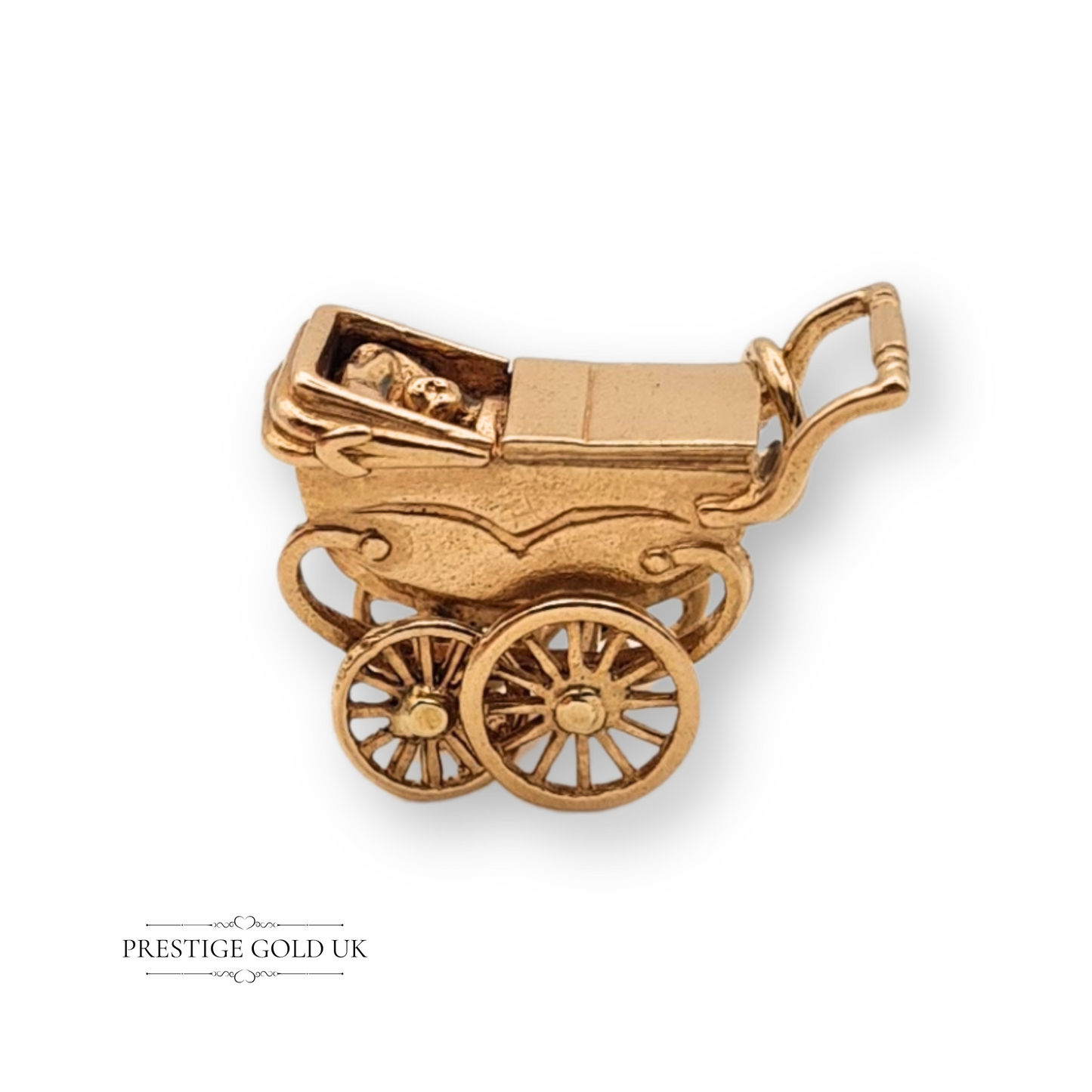 Vintage 9ct gold pram charm with a baby figure inside, fully hallmarked Birmingham 1970, detailed with spoked wheels, curved handle, and old-fashioned design, measuring 22mm x 9mm.