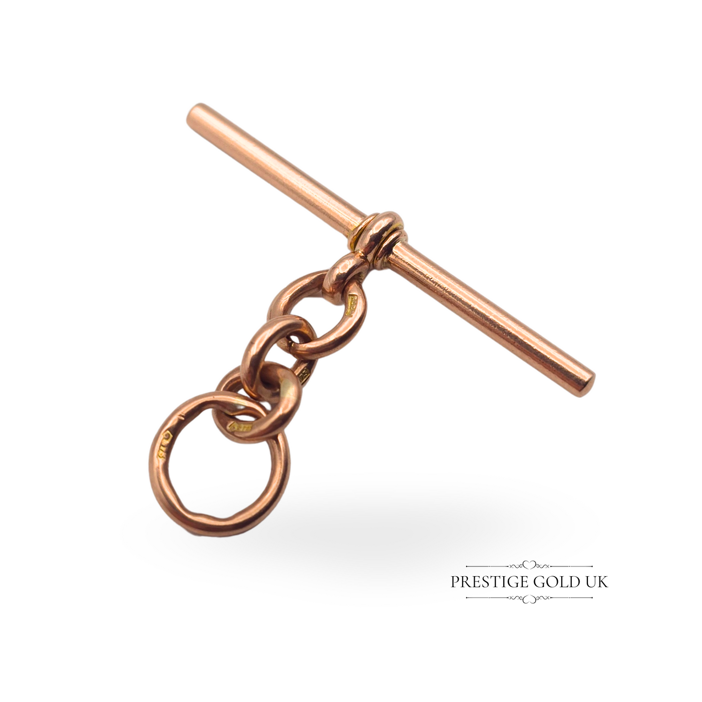 Close-up of an antique 9ct rose gold Albert chain T-bar, showcasing its solid gold construction and vintage charm.