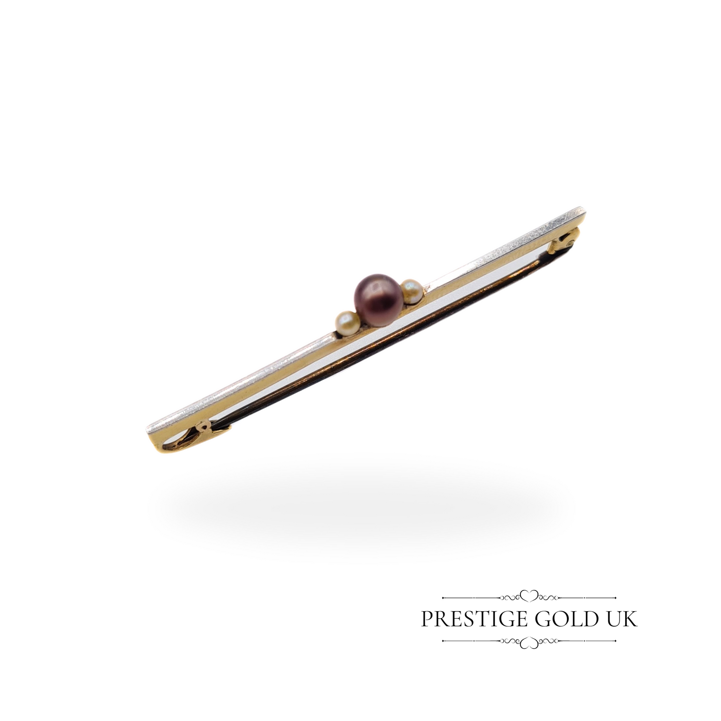 Vintage 9ct gold bar brooch featuring a central black pearl and two white pearls, 4.5cm in length.