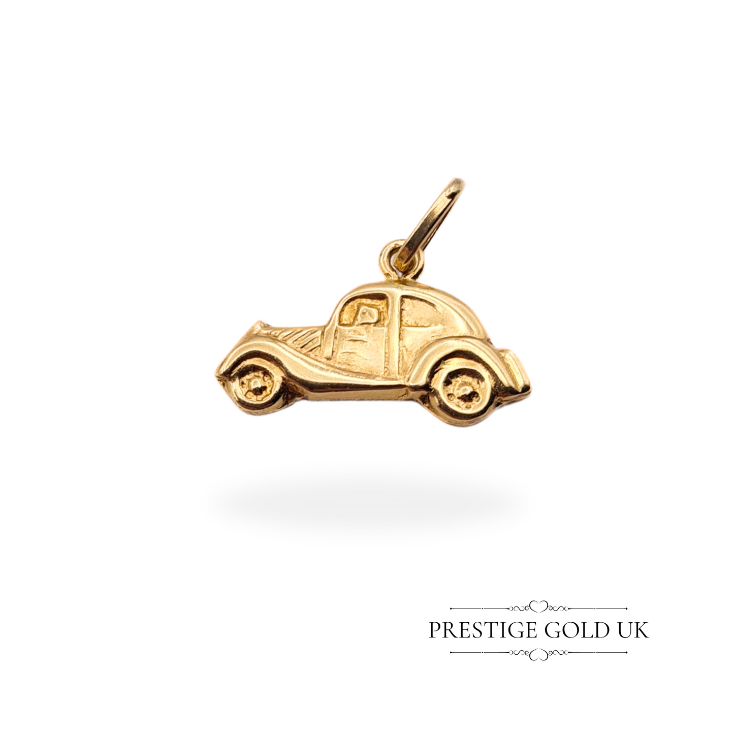 Close-up of a 9ct gold vintage car charm with a hollow construction, designed in a classic 1930s-1940s style.