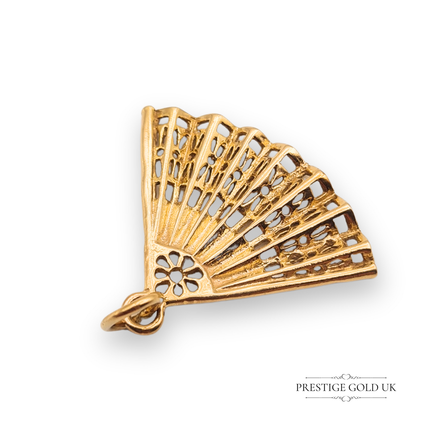 Vintage 9ct yellow gold fan charm with articulated blades, hallmarked Birmingham 1979, measuring 23mm x 28mm, featuring a delicate retro design ideal for charm bracelets or collectors.