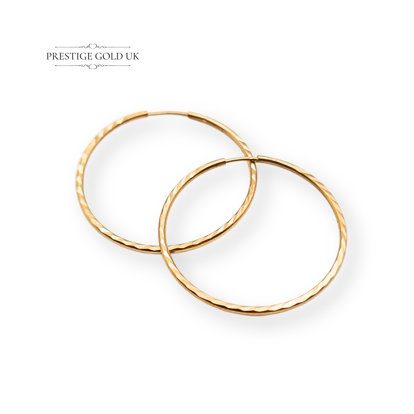 Pair of 9ct gold hoop earrings with chevron pattern, stamped 375 and fully tested, measuring 18mm in diameter and 1mm thick. Lightweight 0.32g sleepers, dainty and comfortable for everyday wear, classic small gold hoop design.