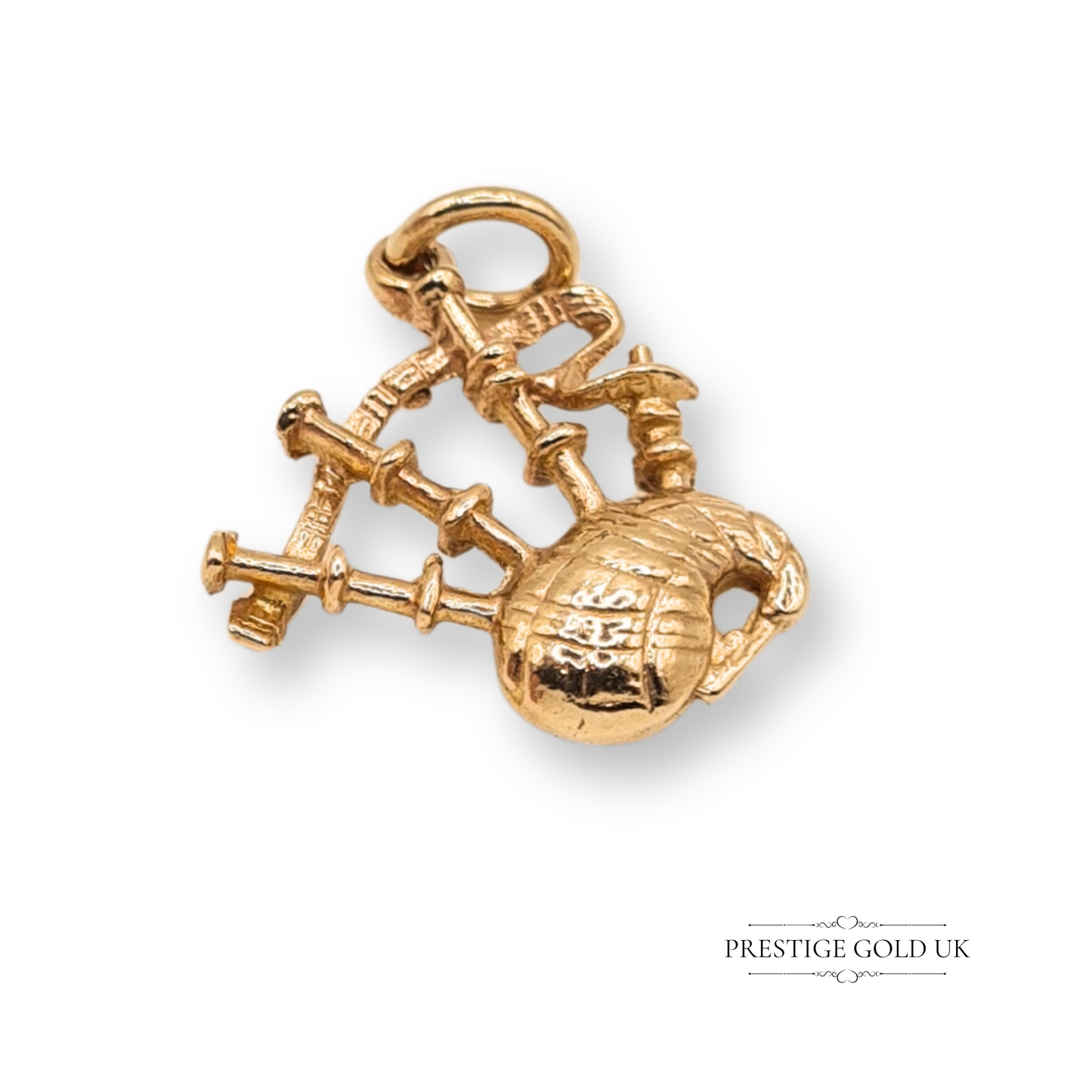 9ct yellow gold bagpipes charm with Birmingham hallmark dated 1963, featuring detailed Scottish bagpipes design, 19mm by 17mm, perfect for music lovers or as a Scottish souvenir gift