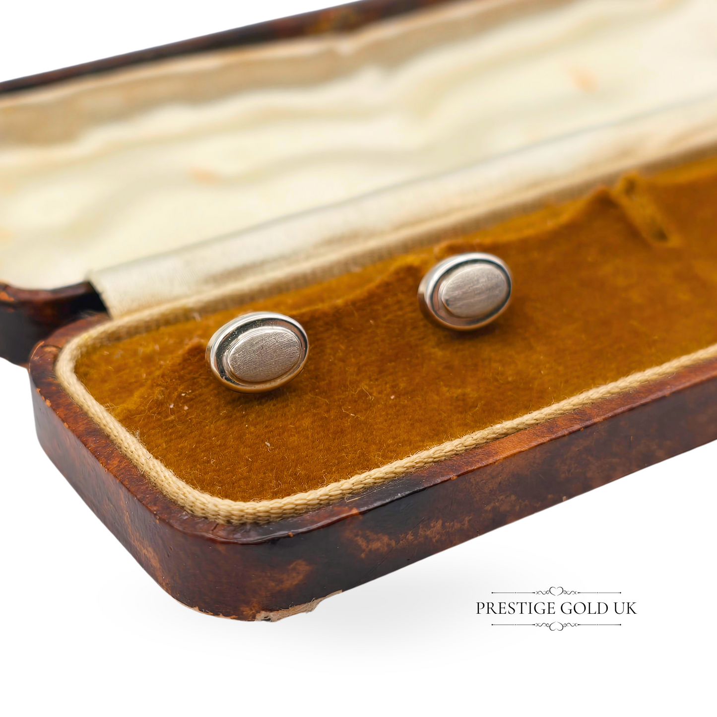 Pair of vintage 9ct white gold stud earrings with an elegant oval shape, measuring 8x6mm, lightweight at 0.7g, featuring a minimalist design with stamped 375 backs—ideal for everyday wear or gifting.