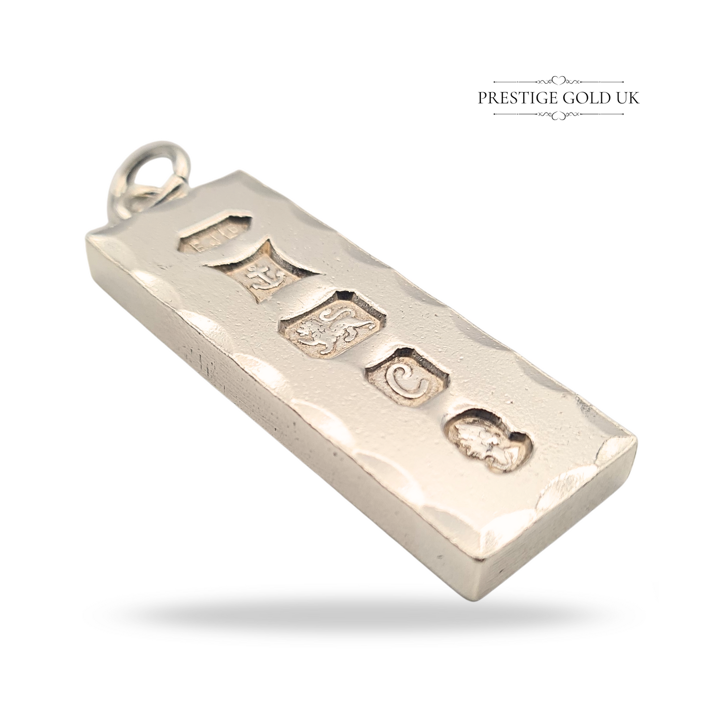 Solid 925 sterling silver large ingot pendant weighing 29.40 grams, measuring 46mm x 15mm x 4mm, hallmarked Birmingham 1977 with maker’s mark EJLD, anchor, lion passant, letter C date mark, duty mark, polished with fancy faceted edges.