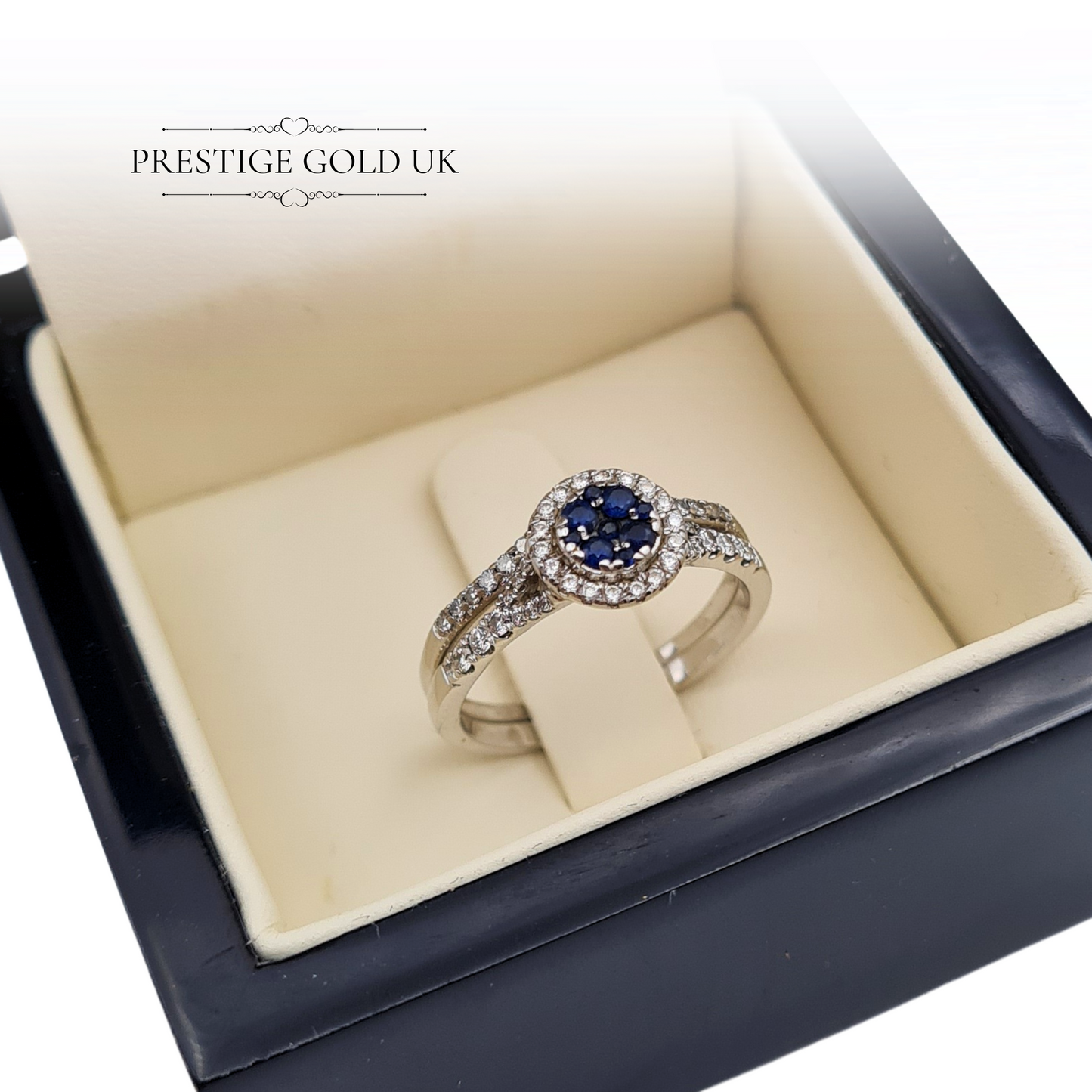 Sapphire and diamond halo engagement ring in 18ct white gold with a complementary wedding band, displayed elegantly in a jewellery box.