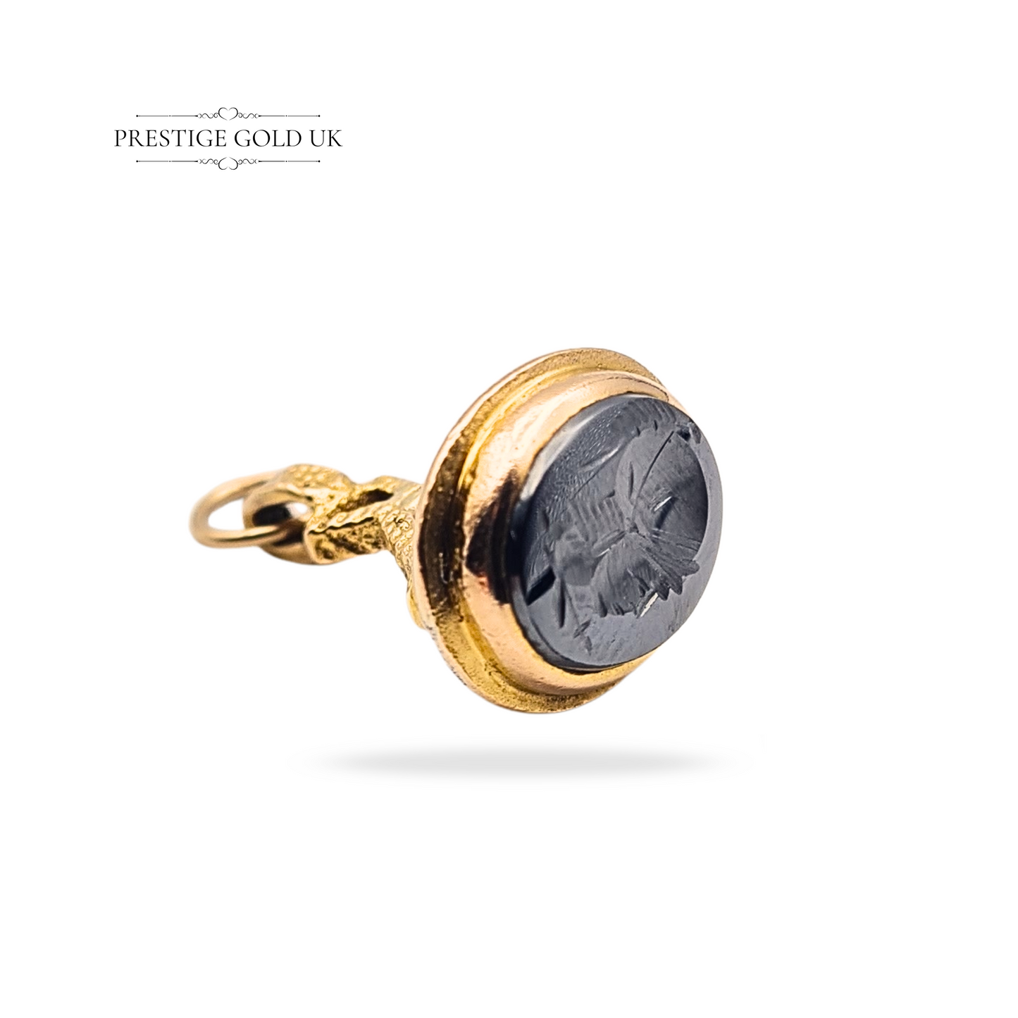 Vintage 9ct gold fob pendant with hematite intaglio seal, engraved with a Roman centurion motif. Fully hallmarked, bezel-set oval design measuring 20mm x 15mm, weight 4.6g. Antique-style collectible jewellery piece in excellent condition.