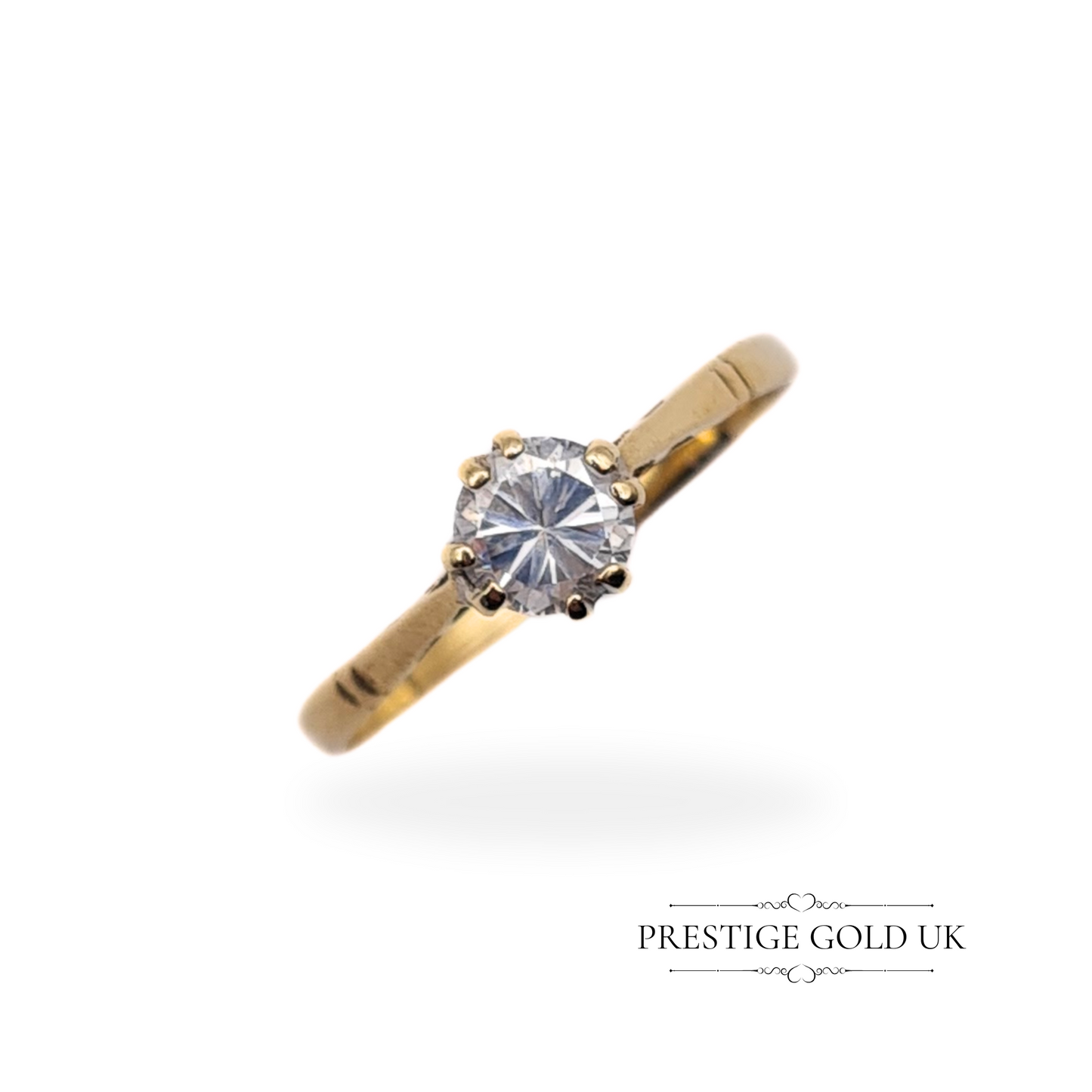 Floating view of the CZ solitaire ring, showcasing the 5mm stone and slim gold band in perfect harmony.