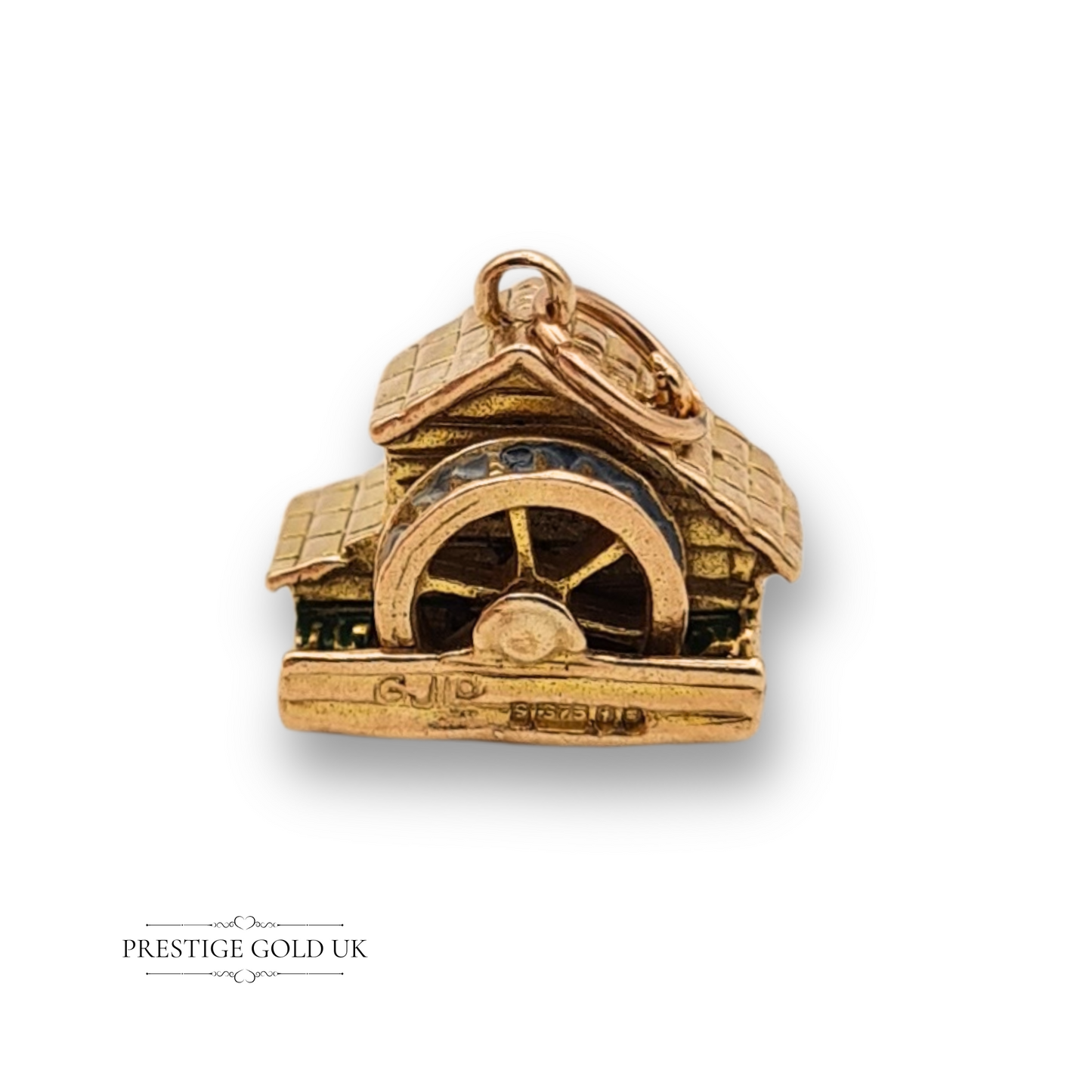 Rare 9ct yellow gold water wheel charm by Georg Jensen, dated 1974, with enamel accents, textured roof, detailed water wheel, and London hallmarks, measuring 13mm x 12mm.