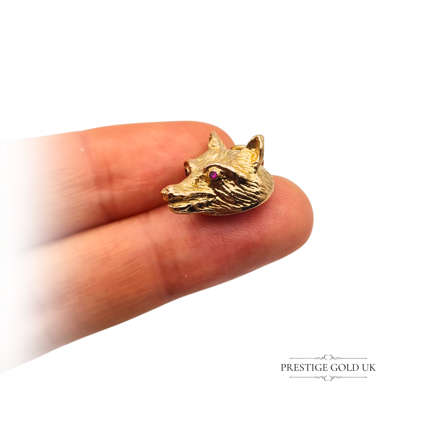 9ct gold fox head charm with purple gemstone eyes, hallmarked London 1972, detailed animal design pendant in yellow gold, vintage British jewellery piece