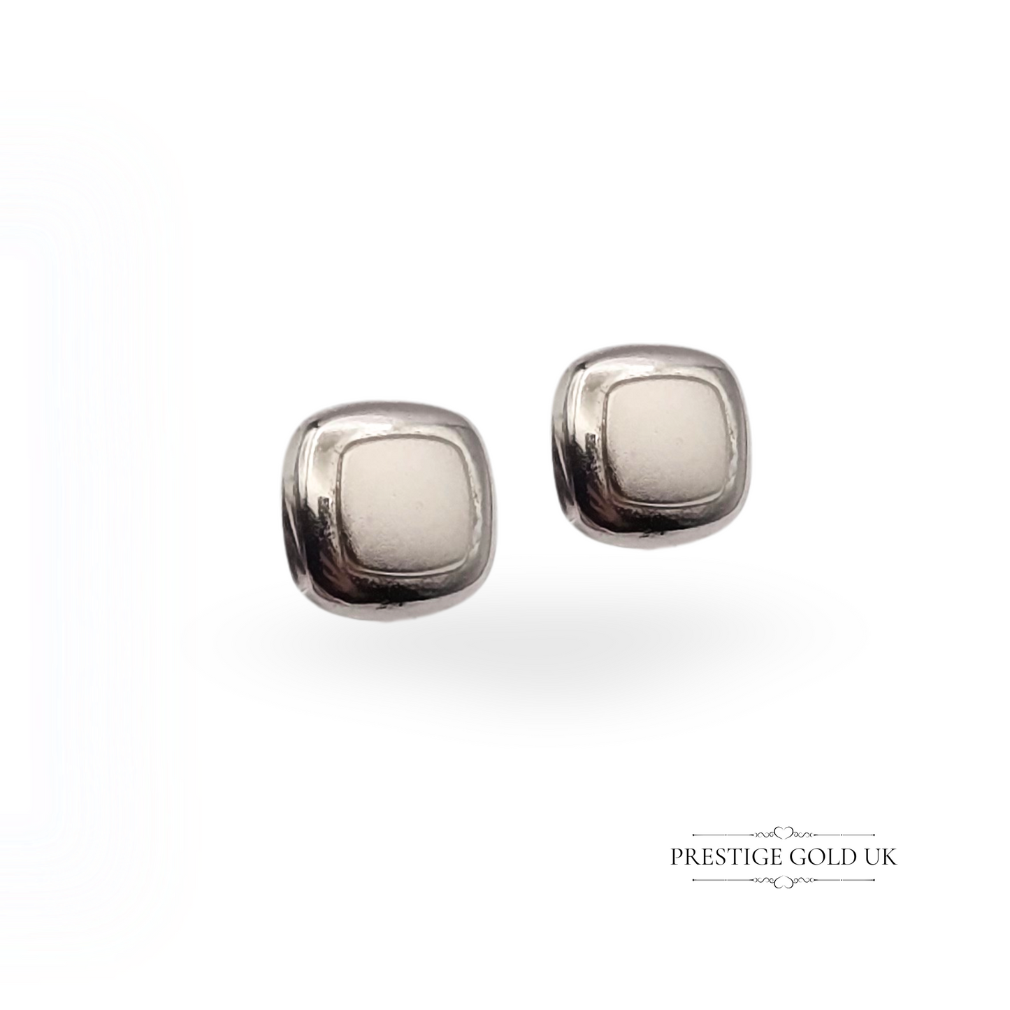 Vintage 9ct white gold stud earrings featuring a small 6x6mm rounded square design with softly radiused edges, stamped 9ct and weighing 0.5g—lightweight and minimalist, ideal for everyday wear or gifting.