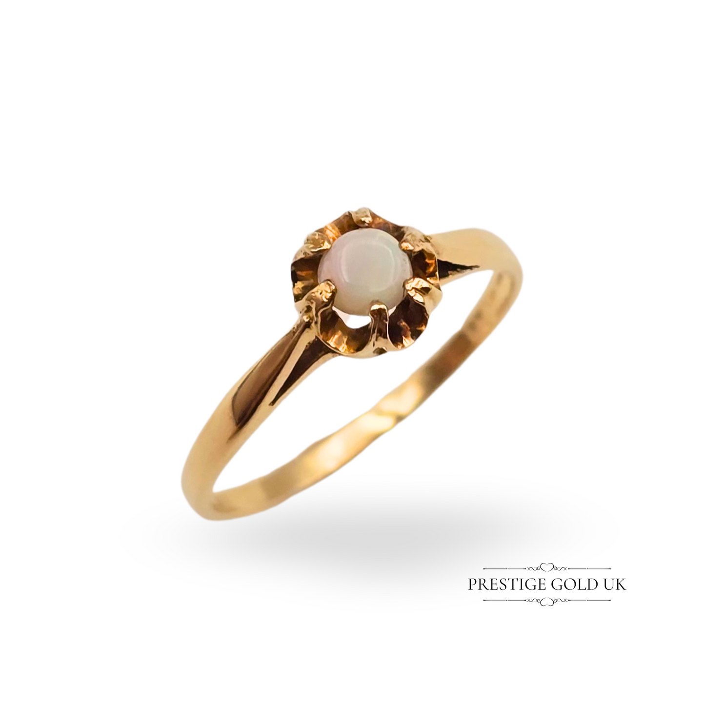 A vintage 9ct gold solitaire ring featuring a round opal in a six-claw floral-style setting, hallmarked in London in 1982, UK ring size L (US 6 / EU 51.5); an elegant and timeless piece of vintage jewellery ideal for collectors or as a thoughtful gift.