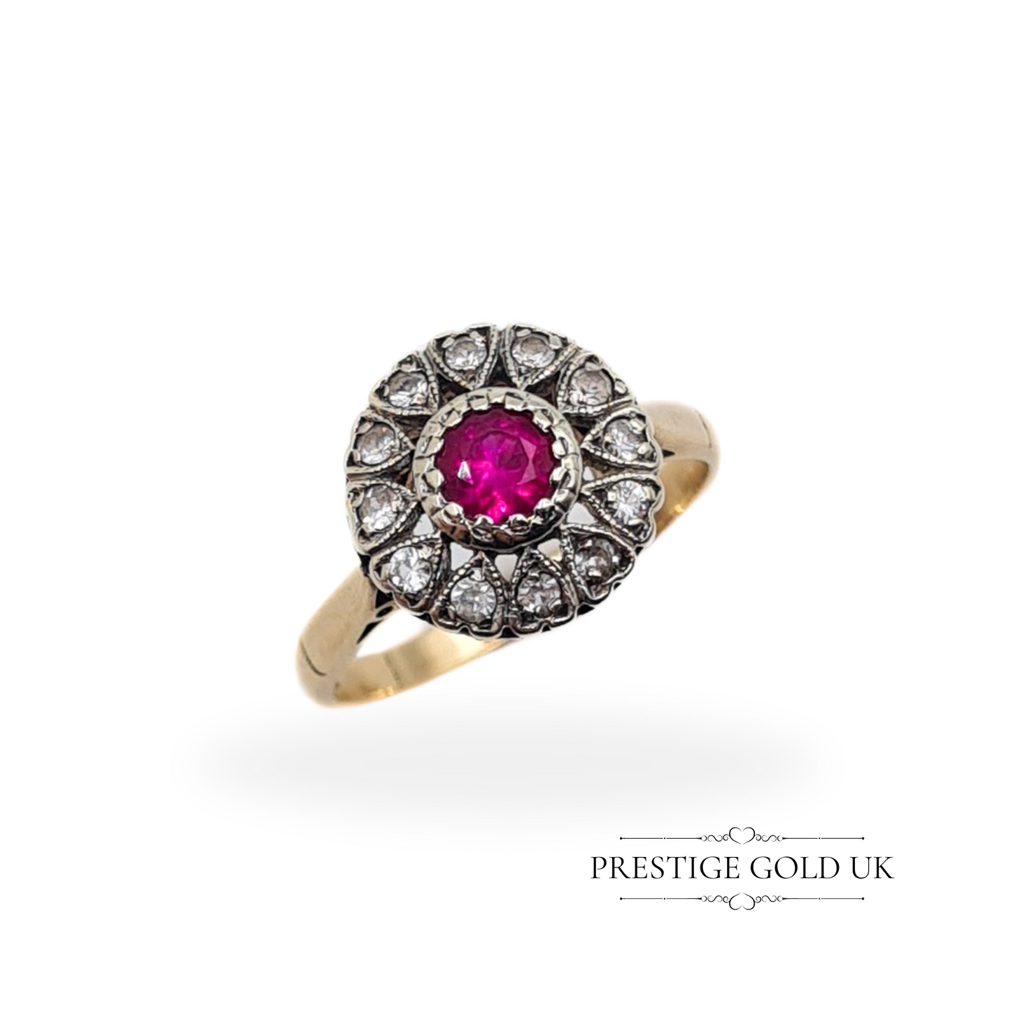 9ct gold cluster ring with a ruby-red paste stone centre, surrounded by sparkling white paste stones in a floral halo design, set in yellow gold.