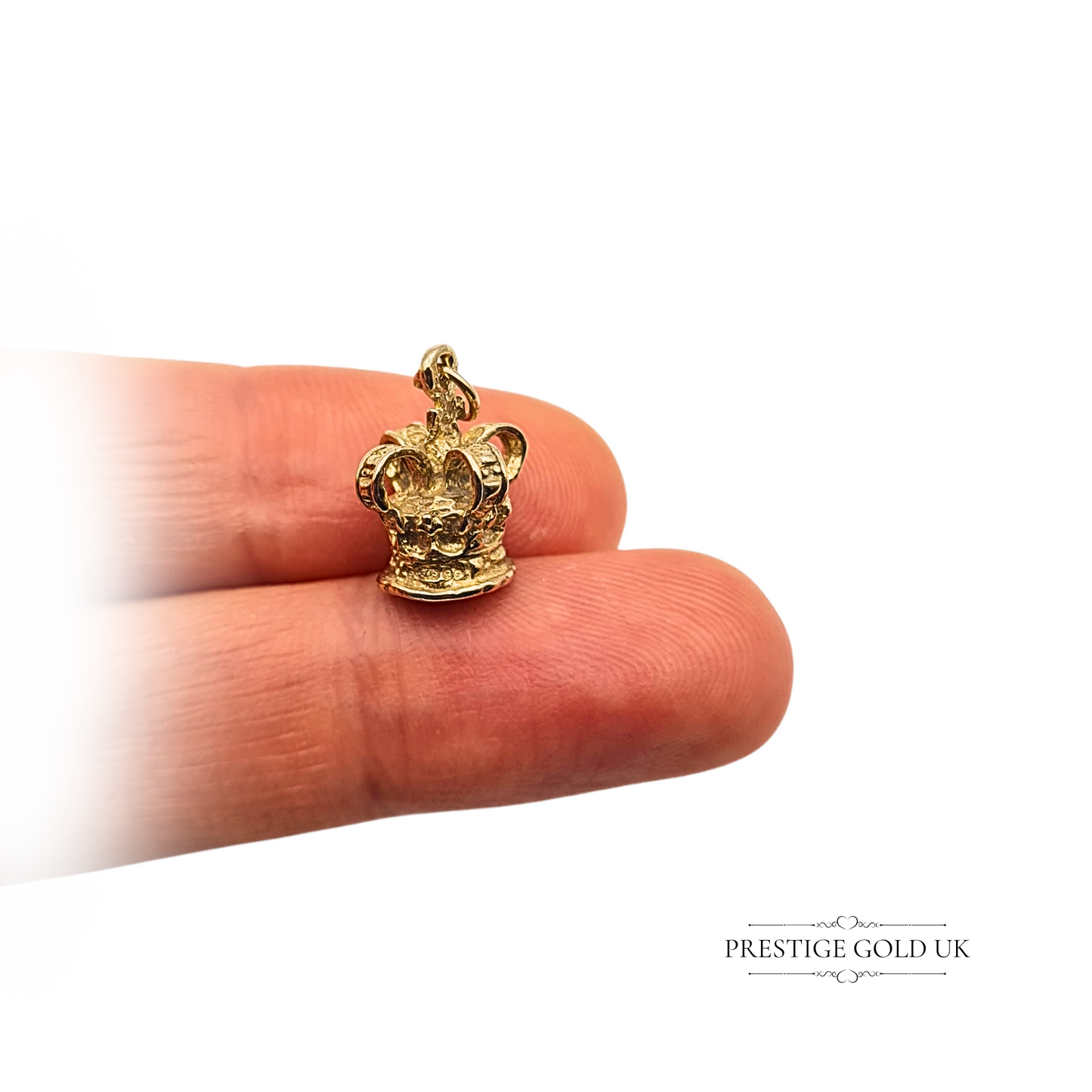 Vintage 9ct gold miniature crown charm pendant, hallmarked London 1968. Weighs 1.7g, measures 13mm x 11mm x 9mm. Detailed royal crown design, suitable as a pendant or bracelet charm, collectible British gold jewellery piece in excellent condition.