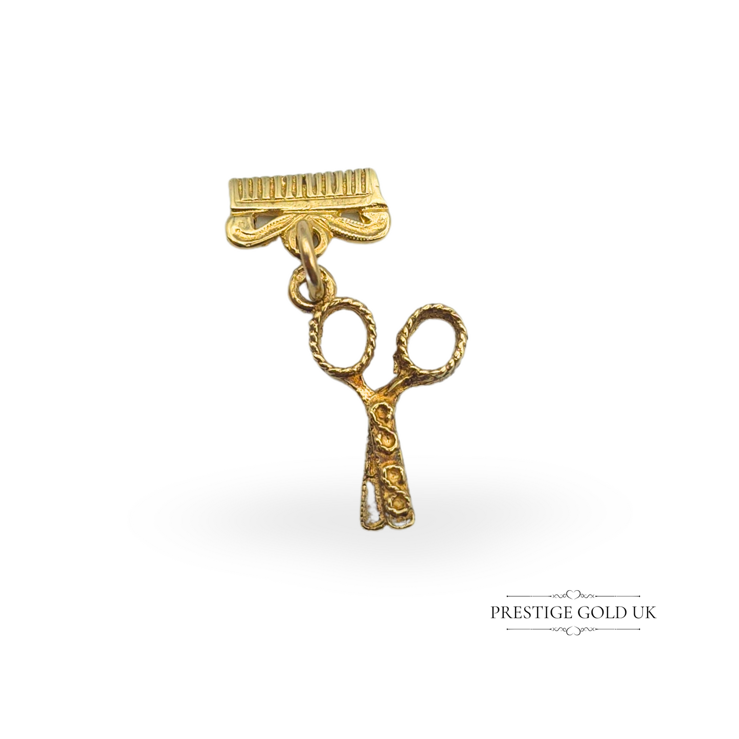 Vintage 9ct gold scissors and comb charm, hallmarked TL LD, with intricate detailing. Scissors measure 18mm, comb 11mm. A unique jewellery piece perfect for hairdressers, barbers, or collectors. A stylish gold charm for a bracelet or pendant.