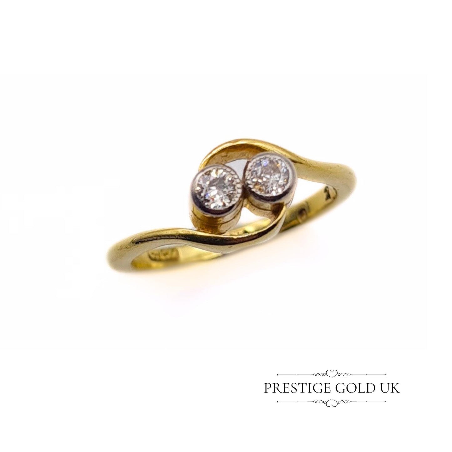18ct gold crossover ring featuring two 0.03-carat diamonds, size UK I, with a stamped 18K hallmark and 2.6 grams weight. Elegant design with delicate diamond accents, perfect for a refined, sophisticated look.