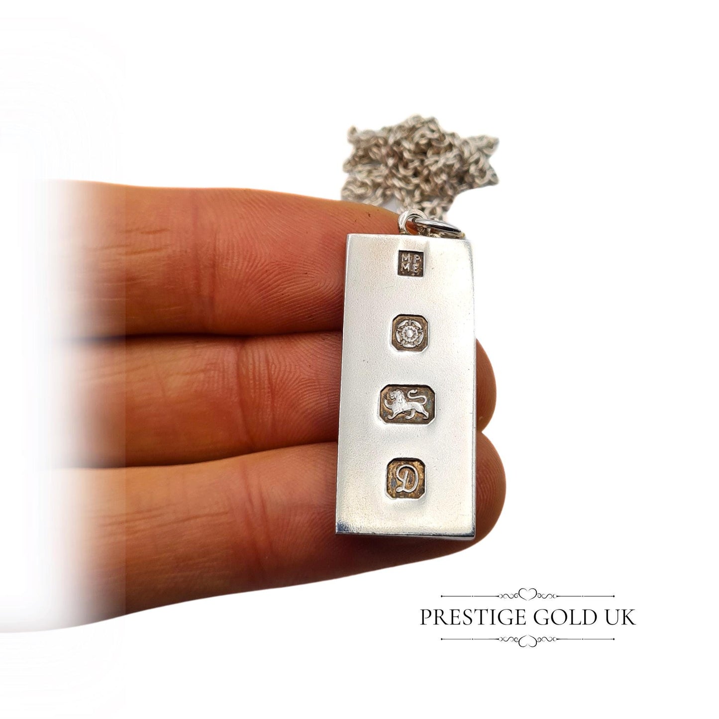 Vintage solid 925 sterling silver ingot pendant with a full Chester hallmark dated 1979, measuring 37mm tall and 15mm wide, on a 20-inch chain. A substantial 21.5g piece, perfect for vintage jewellery collectors or as a unique gift.