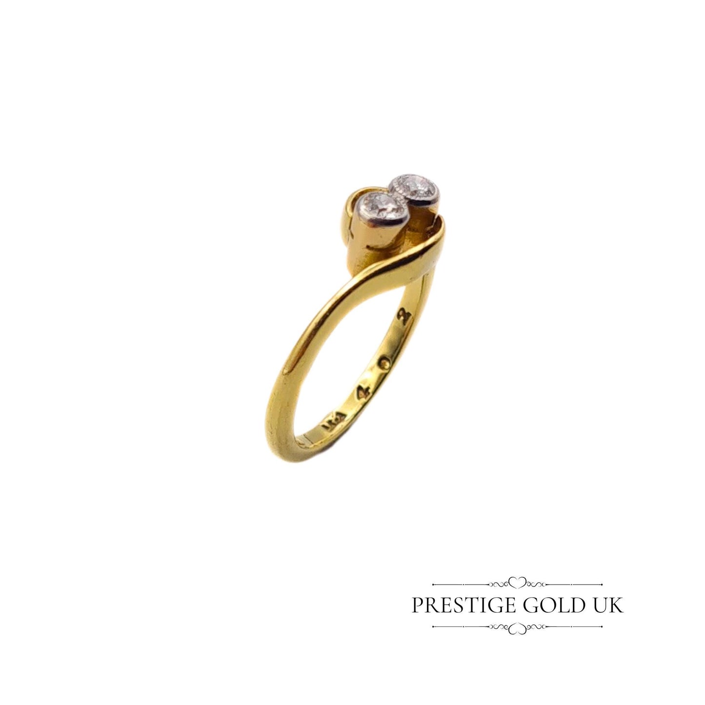 18ct gold crossover ring featuring two 0.03-carat diamonds, size UK I, with a stamped 18K hallmark and 2.6 grams weight. Elegant design with delicate diamond accents, perfect for a refined, sophisticated look.
