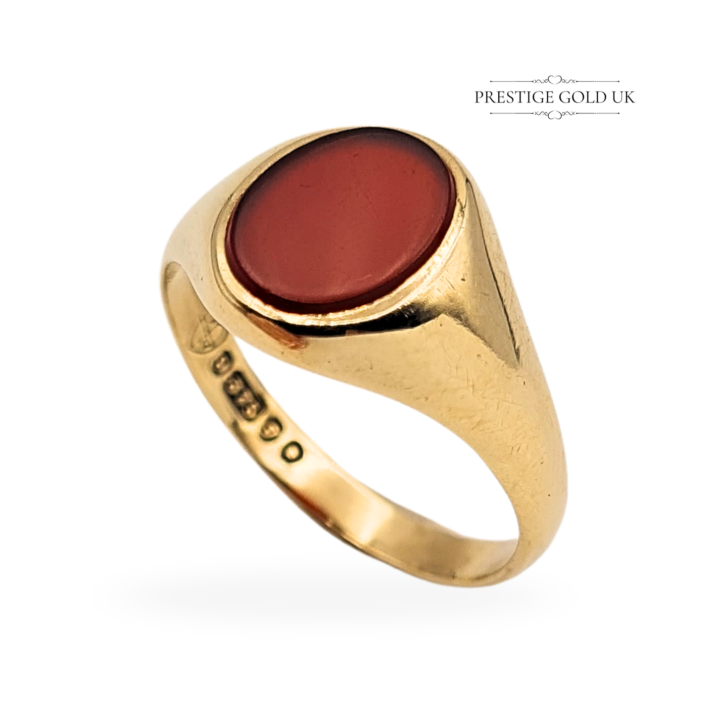 Vintage 9ct gold signet ring featuring a smooth oval carnelian gemstone, fully hallmarked in London 1962. Weighing 2.80g and sized UK P 1/2 (US 8), this polished gold ring offers classic British craftsmanship and mid-century style in excellent condition.
