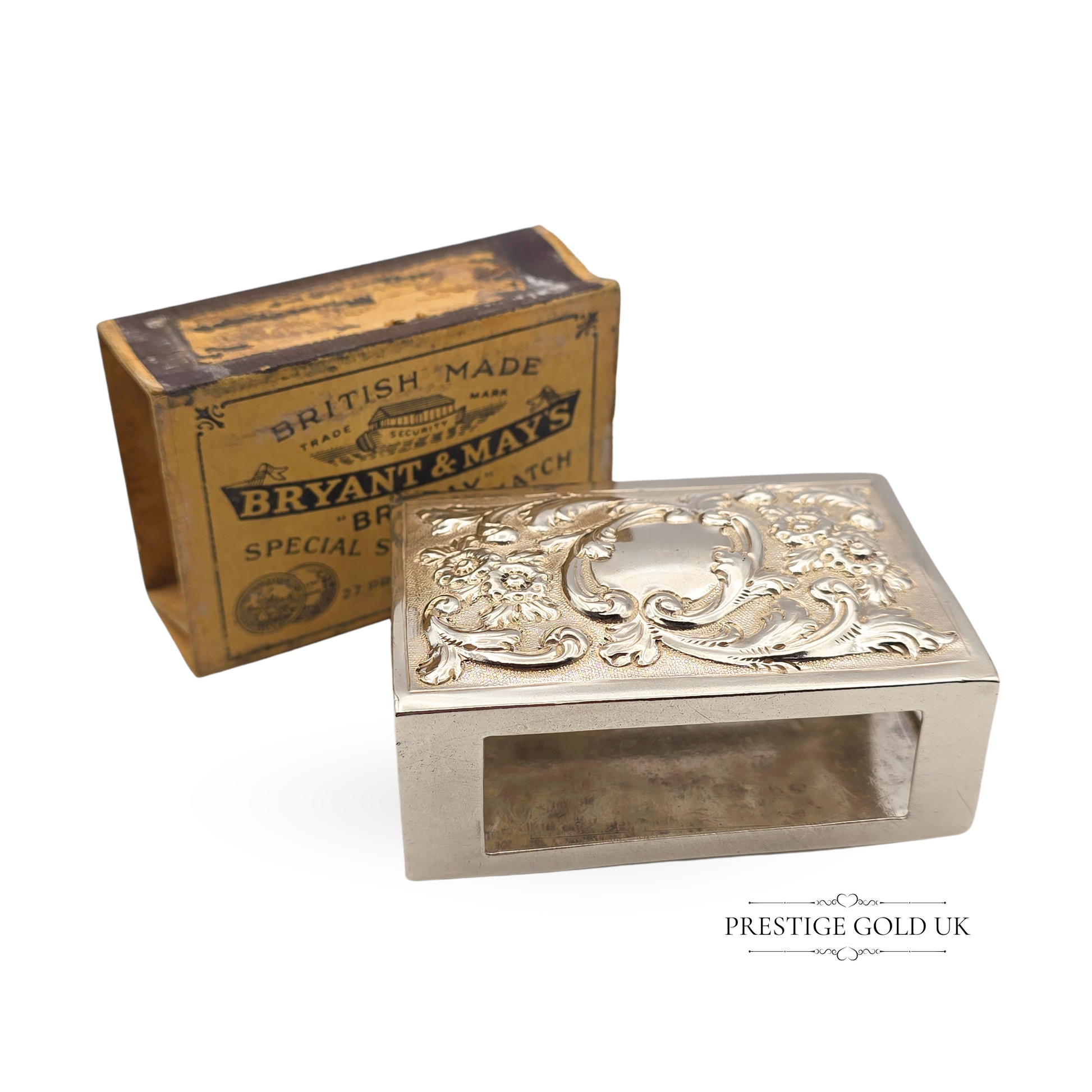 Antique solid silver matchbox holder hallmarked London 1901, featuring ornate Rococo floral scrollwork on top, crafted by Joseph Braham, includes vintage Bryant & May’s matchbox, measuring 3 inches long, 2 inches wide, and 1.25 inches tall.