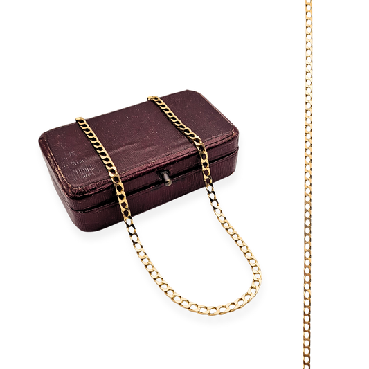 Close-up of a 9ct solid gold flat curb chain necklace with British hallmarks, 26 inches (66 cm) long and 2.7 mm wide, featuring a polished finish and secure spring ring clasp; sleek unisex design displayed against a neutral background.