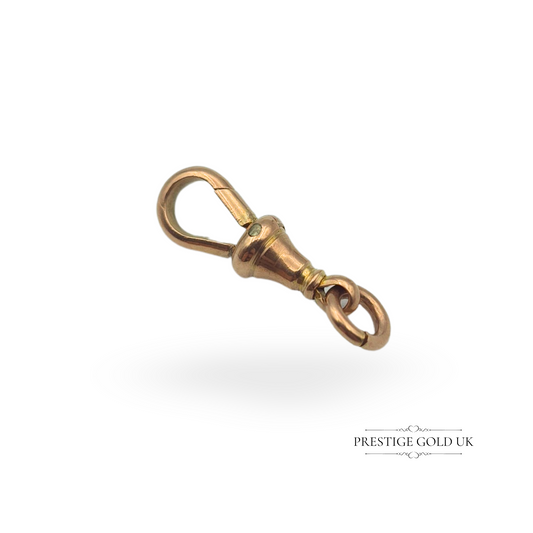 A vintage 9ct rose gold dog clip swivel clasp, measuring 22mm in length including the bolt ring. Stamped 9c and fully tested, this elegant gold clip is ideal for watch chains, charm holders, or antique jewellery restoration.