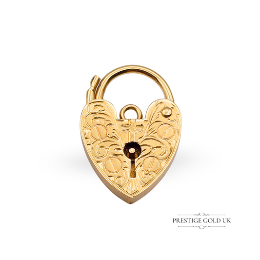Vintage 9ct gold heart padlock charm with finely hand-engraved Christian cross and scrollwork, measuring 18x12mm, hallmarked London, 1.5g, with working clasp – a unique devotional and faith-inspired jewellery piece.