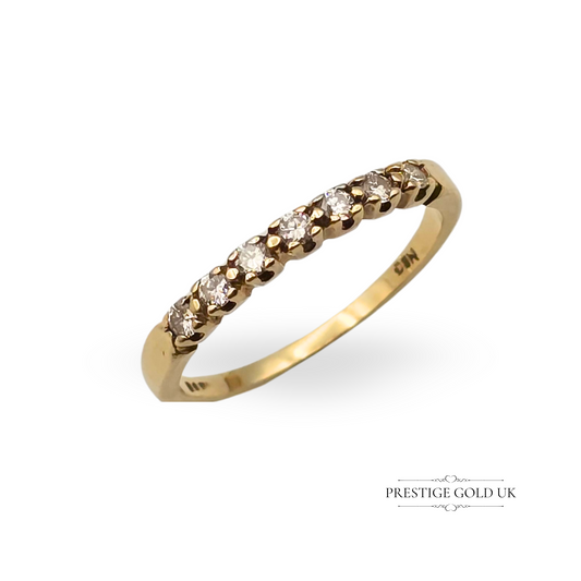 9ct gold half eternity ring with nine sparkling diamonds in a claw setting, dated London 1982, UK ring size K 1/2, weighing 1.2g. A timeless and dainty vintage ring perfect for gifting or stacking.
