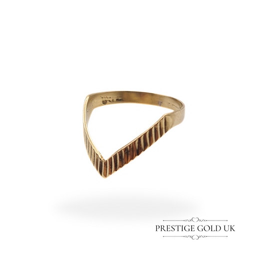 A fully hallmarked 1986 9ct gold ring in a V-shape, ideal for stacking or wearing alone.
