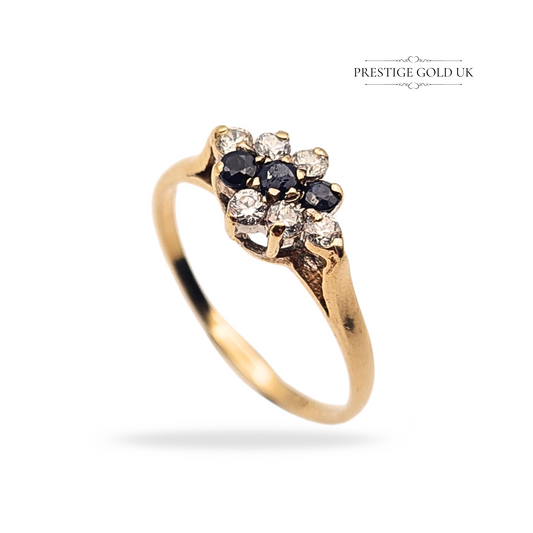 Vintage 9ct gold cluster ring, London 1990 hallmark, featuring 9 alternating sapphires and CZ stones in a dainty 3-row floral setting. Weighs 1.3g, UK size L 1/2 (US 6). Lightweight and feminine with sparkling detail.