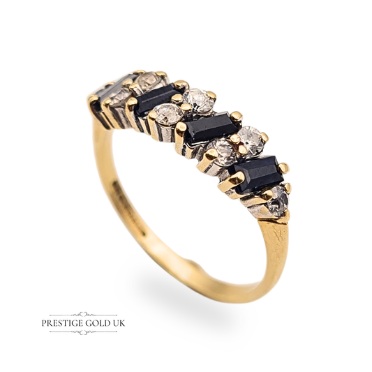 Vintage 9ct gold half eternity ring featuring 4 blue sapphires and 8 cubic zirconia stones in a staggered prong setting, 5mm wide band with Birmingham hallmark, a sparkling gold gemstone ring ideal for stacking or statement wear.