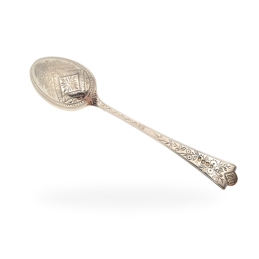 Antique sterling silver teaspoon, hand engraved with floral and geometric details, hallmarked Birmingham 1889 from the Queen Victoria era. Measures 15cm (5 3/4") long, weighing 21.4g. Elegant collectible British silverware with ornate decoration.
