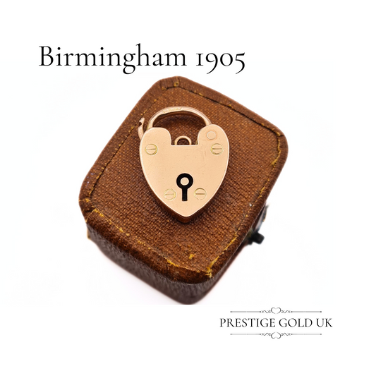 An antique 9ct rose gold heart padlock charm, measuring 20x15mm, fully hallmarked in Birmingham in 1905, showcasing Victorian design details.