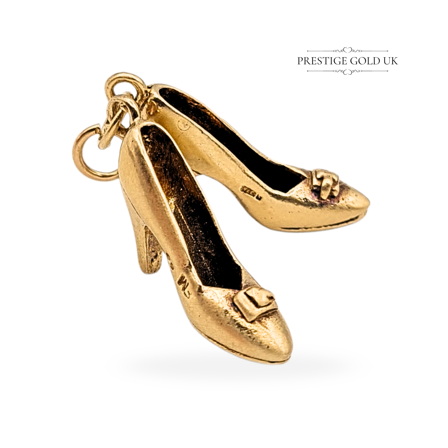 Solid 9ct gold vintage high heel shoes charm, hallmarked London 1973, weighing 3.55g, measuring 19mm x 10mm x 5mm, detailed retro pair design with crisp features and clear hallmarks — ideal for collectors or statement jewellery lovers.