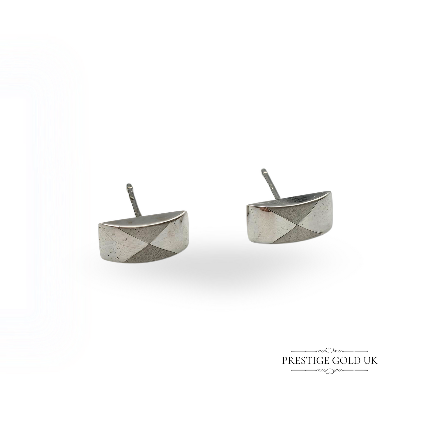 Pair of vintage 9ct white gold rectangular stud earrings with a domed front and two-tone triangular design, measuring 9x4mm and weighing 0.7g—stamped 375, elegant and lightweight for everyday wear or gifting.