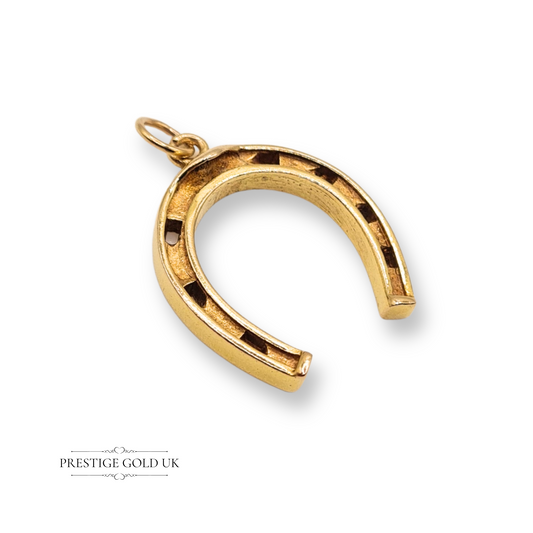 9ct yellow gold horseshoe pendant with London hallmark dated 1967, featuring a classic good luck charm design in polished yellow gold, measuring 26mm by 21mm, perfect for equestrian lovers or as a meaningful gift
