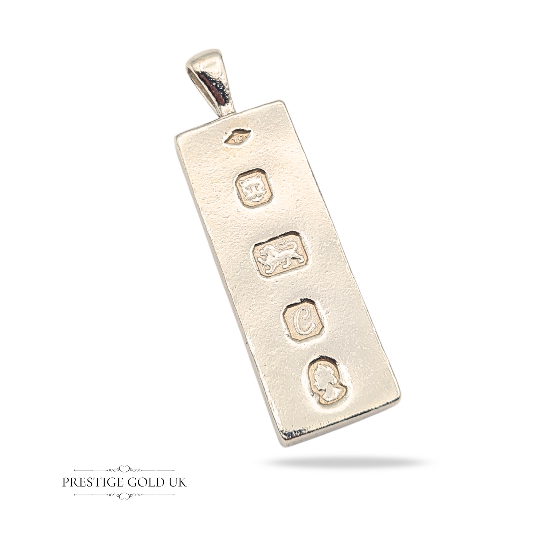 Large 925 sterling silver ingot pendant with London hallmark dated 1977, 53mm tall, 16mm wide, weighing 26.78 grams, featuring maker's mark, lion passant, date letter, and assay office stamps, smooth edges and polished finish.