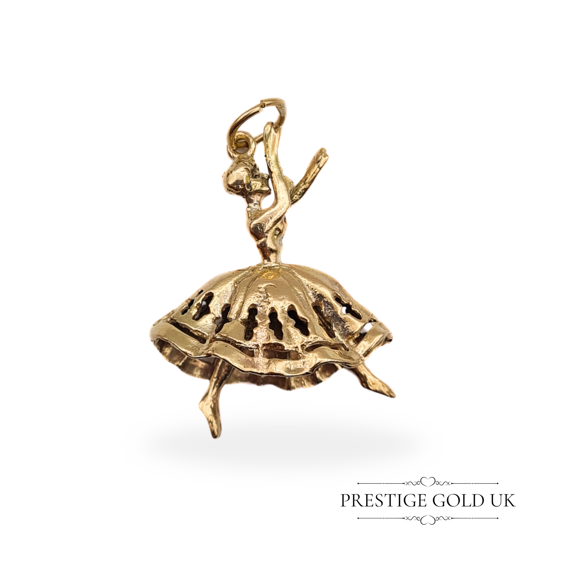 Close-up of a vintage 9ct gold moving dancer charm, featuring a ballerina with articulated legs and detailed craftsmanship, fully hallmarked London 1972.