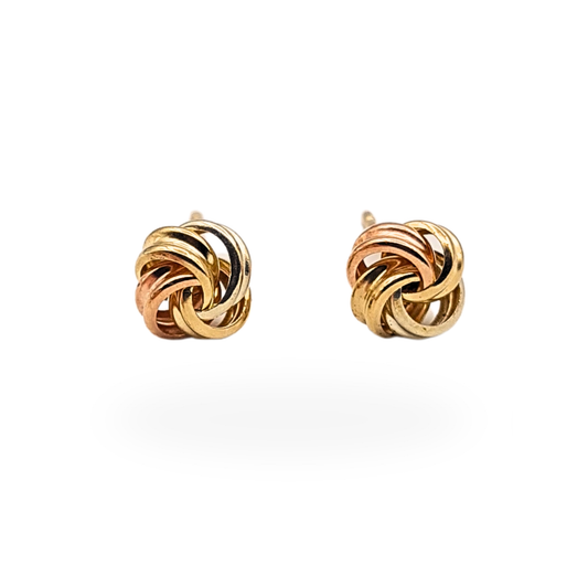Small two-tone 9ct gold knot stud earrings featuring intertwined rose and yellow gold wires forming a classic love knot design, approx. 6mm face with post and butterfly backs. Not hallmarked but fully tested as 9ct gold, lightweight everyday stud earrings.
