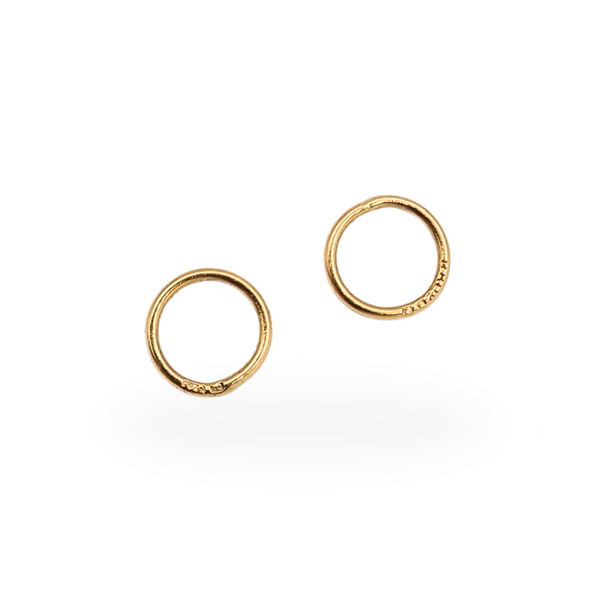 Pair of hallmarked 9ct gold closed jump rings with 375 marks, suitable for jewellery repair and restoration.