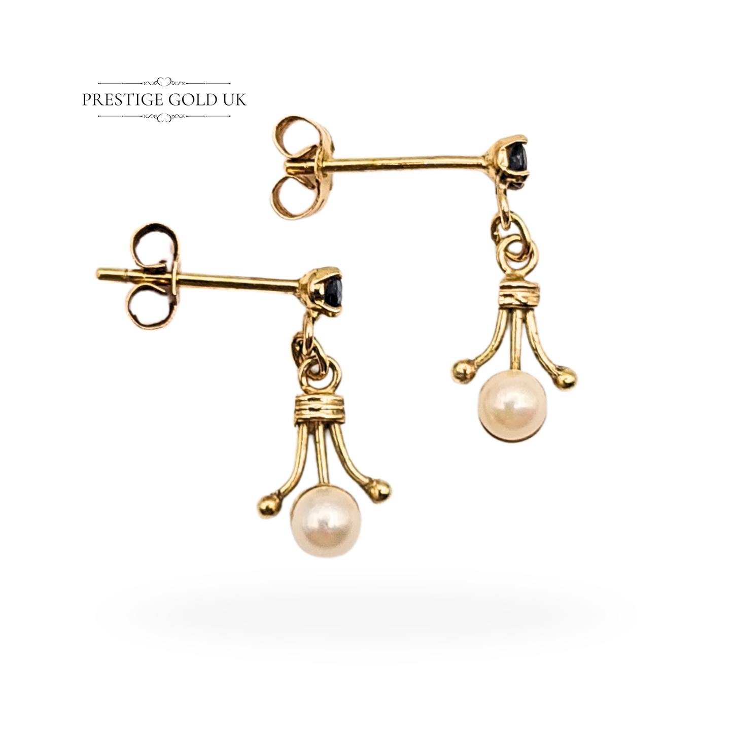 Pair of tiny 9ct yellow gold dangle earrings with pearls and blue sapphires, 15mm drop, 3.5mm pearls, tested but unhallmarked, ornate Victorian-style gold setting with butterfly backs, photographed by Prestige Gold UK.