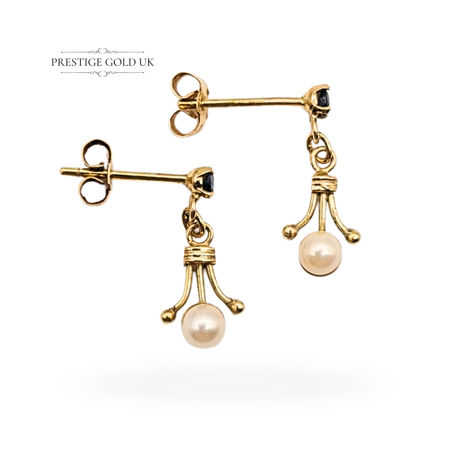 Pair of tiny 9ct yellow gold dangle earrings with pearls and blue sapphires, 15mm drop, 3.5mm pearls, tested but unhallmarked, ornate Victorian-style gold setting with butterfly backs, photographed by Prestige Gold UK.