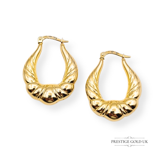 Pair of 9ct gold chunky creole hoop earrings, hollow design, 29mm tall, 23mm wide, 7mm deep, ridged and polished finish, Sheffield import mark 1993, lightweight and bold