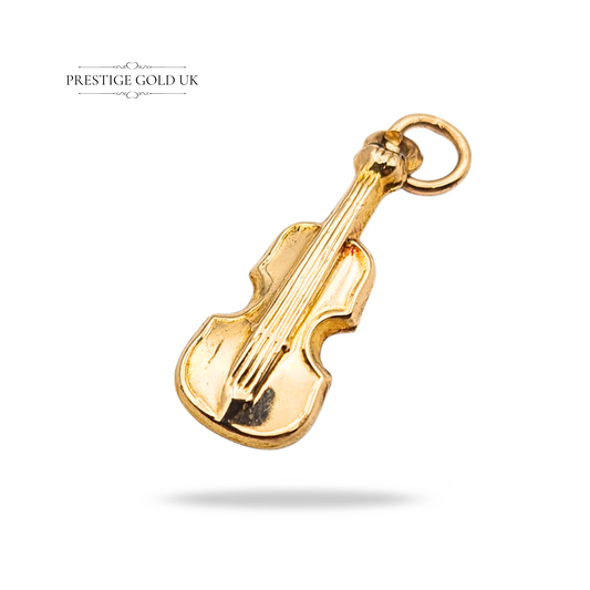 Vintage 9ct gold violin charm, hallmarked Chester 1957, measuring 18mm tall, 7mm wide, and 2mm deep. Weighs 0.36 g, a tiny collectible musical instrument charm ideal for a pendant or bracelet. Rare hallmarked gold jewellery piece.