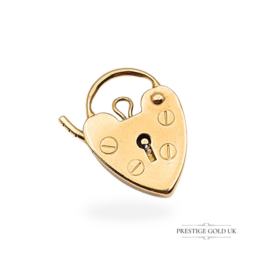 Tiny vintage 9ct gold heart padlock charm with screwhead and keyhole detail, dated London 1980, fully hallmarked. Measures 15mm tall and 11mm wide, ideal as a clasp for gold bracelets or as a sentimental pendant charm.
