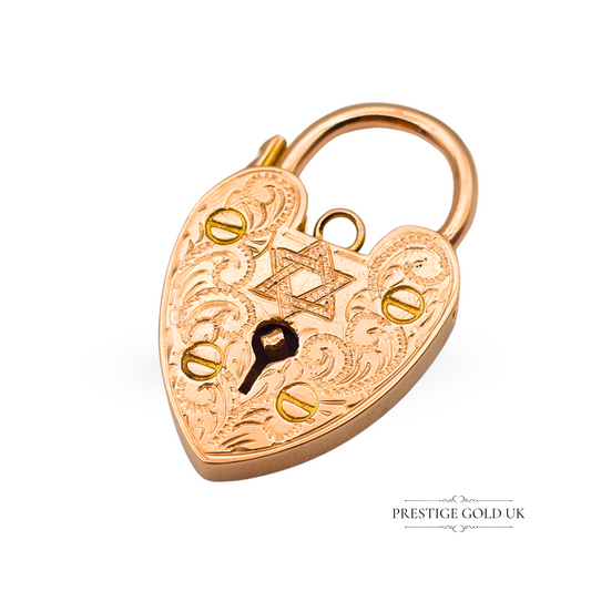 Antique 9ct rose gold heart padlock charm with intricate hand engraving, featuring a Star of David design. Stamped 375, measuring 28mm, perfect as a symbolic pendant or clasp. Vintage and collectible, rare gold jewellery piece.
