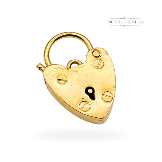 Vintage 9ct yellow gold heart padlock clasp by Georg Jensen, fully hallmarked London 1977. Measures 17mm tall x 11mm wide, weight 1.36g, with working hinge and polished finish. Ideal as bracelet fastener or pendant charm.
